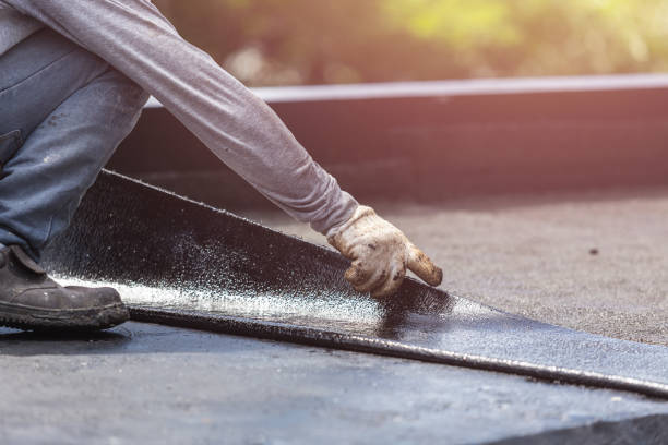 Professional Basement Waterproofing technician working in Woodstock, OH